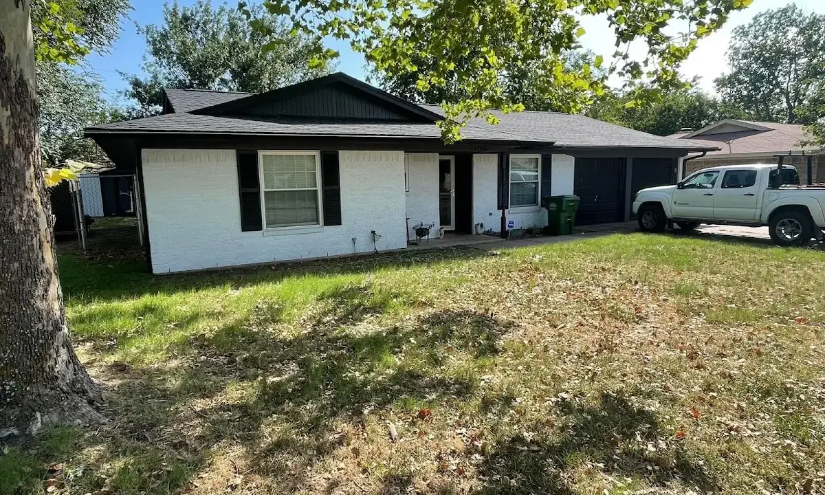 Professional roofing crew working on a residential roof in Takoma Park